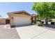 Attractive home with a well-manicured lawn, mature landscaping, and convenient two-car garage enhancing its curb appeal at 7050 S Fawn Ave, Gilbert, AZ 85298