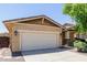 Home's two-car garage with stone veneer pillars offers ample parking and storage space at 7050 S Fawn Ave, Gilbert, AZ 85298
