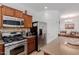 Well-equipped kitchen with stainless steel appliances, gas range, and center island offering functionality and style at 7050 S Fawn Ave, Gilbert, AZ 85298