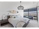 Chic bedroom with modern lighting, city views, and a cozy daybed, creating a stylish and comfortable retreat at 7180 E Kierland Blvd # 811, Scottsdale, AZ 85254