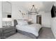 Modern bedroom featuring a unique light fixture and stylish decor, creating a serene and sophisticated atmosphere at 7180 E Kierland Blvd # 811, Scottsdale, AZ 85254