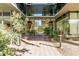 The building entrance is landscaped with desert flora and has stone pavers leading to the all-glass entry at 7180 E Kierland Blvd # 811, Scottsdale, AZ 85254