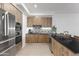 Well-equipped kitchen with stainless steel appliances, sleek cabinetry, and a tiled backsplash at 7180 E Kierland Blvd # 811, Scottsdale, AZ 85254
