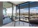 Bright office with a glass desk offering stunning city and mountain views, perfect for inspired work sessions at 7180 E Kierland Blvd # 811, Scottsdale, AZ 85254