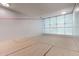 Well-lit squash court with hardwood floors and glass wall at 7180 E Kierland Blvd # 811, Scottsdale, AZ 85254