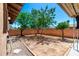 A backyard with trees and a gravel area offers a simple outdoor space at 7360 N 38Th Dr, Phoenix, AZ 85051