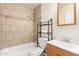 Bathroom features a tub shower combo and wood vanity at 7360 N 38Th Dr, Phoenix, AZ 85051