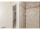 Bathroom features a tile shower, and door to another room at 7360 N 38Th Dr, Phoenix, AZ 85051