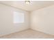Bright bedroom with neutral walls, tile flooring, and a window at 7360 N 38Th Dr, Phoenix, AZ 85051