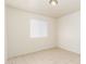 Bright bedroom with neutral walls, tile flooring, and a window at 7360 N 38Th Dr, Phoenix, AZ 85051