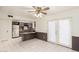 Open dining room with tile floors and access to the kitchen and outdoor patio at 7360 N 38Th Dr, Phoenix, AZ 85051