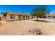 Cozy single-story home featuring a low-maintenance rock yard and mature shade tree at 7360 N 38Th Dr, Phoenix, AZ 85051