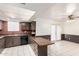 Cozy kitchen features ample cabinets, brick accents and tile flooring at 7360 N 38Th Dr, Phoenix, AZ 85051