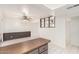 Kitchen with access to living space with tile flooring, ceiling fan, and eat-in bar at 7360 N 38Th Dr, Phoenix, AZ 85051