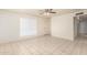 Bright and airy living room featuring tile flooring and a ceiling fan at 7360 N 38Th Dr, Phoenix, AZ 85051