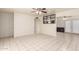 Open living space with tile flooring, ceiling fan, and access to dining area at 7360 N 38Th Dr, Phoenix, AZ 85051