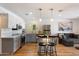 Modern kitchen with white and gray cabinets, stainless appliances, and an island with barstool seating at 7430 E Chaparral Rd # A222, Scottsdale, AZ 85250