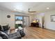 Cozy living room featuring a sliding glass door with balcony access and a modern ceiling fan at 7430 E Chaparral Rd # A222, Scottsdale, AZ 85250