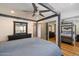 Spacious main bedroom with a four poster bed, ceiling fan, and mirrored closet doors at 7430 E Chaparral Rd # A222, Scottsdale, AZ 85250