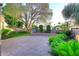 Spacious backyard featuring a large paved patio, lush landscaping, and a privacy wall, perfect for outdoor entertaining at 7596 N Via De La Siesta --, Scottsdale, AZ 85258