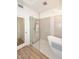 Modern bathroom featuring a glass-enclosed shower and stand-alone soaking tub at 7596 N Via De La Siesta --, Scottsdale, AZ 85258