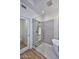 Contemporary bathroom featuring a glass-enclosed shower, freestanding tub, and stylish gray tiling at 7596 N Via De La Siesta --, Scottsdale, AZ 85258