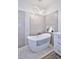 Elegant bathroom with freestanding tub, modern lighting, gray tiling, and contemporary vanity at 7596 N Via De La Siesta --, Scottsdale, AZ 85258