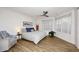Bright bedroom with wood floors, ceiling fan, and lots of natural light from the corner windows at 7596 N Via De La Siesta --, Scottsdale, AZ 85258