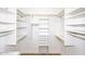 Walk-in closet with a variety of shelving, hanging rods, and storage solutions at 7596 N Via De La Siesta --, Scottsdale, AZ 85258