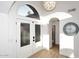 Bright entryway features a stylish light fixture, an arched doorway, and double doors with glass panels at 7596 N Via De La Siesta --, Scottsdale, AZ 85258