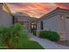 Elegant home entrance features a secure gated entry, stone accents, and lush landscaping at 7596 N Via De La Siesta --, Scottsdale, AZ 85258