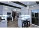 Modern kitchen boasts white cabinets, stainless steel appliances, a breakfast bar, and abundant natural light at 7596 N Via De La Siesta --, Scottsdale, AZ 85258