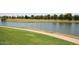 Golf course view with a tranquil lake and walking path, offering a peaceful setting for recreation and relaxation at 7596 N Via De La Siesta --, Scottsdale, AZ 85258