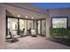 Comfortable patio space with neutral furniture and sliding glass doors to the interior living area at 7596 N Via De La Siesta --, Scottsdale, AZ 85258