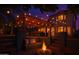 Relaxing backyard with a fire pit, outdoor seating, string lights, and a cozy atmosphere at 838 E Nolan Pl, Chandler, AZ 85249