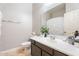 Well-lit bathroom with a modern vanity, vessel sink, and elegant fixtures, plus a toilet and towel rack at 838 E Nolan Pl, Chandler, AZ 85249