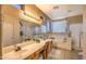 Well-lit bathroom featuring double sinks, large mirrors, and a separate tub and shower for convenience at 838 E Nolan Pl, Chandler, AZ 85249