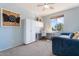 Bright bedroom with a ceiling fan, a desk, a daybed, and built-in storage and workspace at 838 E Nolan Pl, Chandler, AZ 85249