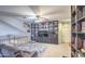 Upstairs bonus room with built-in bookshelves and comfortable seating with a ceiling fan at 838 E Nolan Pl, Chandler, AZ 85249