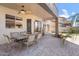 Covered patio featuring ceiling fan, dining set, and outdoor living space at 838 E Nolan Pl, Chandler, AZ 85249