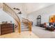 Grand foyer with a curved staircase, elegant tile flooring, and high ceilings for a luxurious entrance at 838 E Nolan Pl, Chandler, AZ 85249