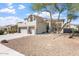Inviting front yard with desert landscaping, mature trees, and a charming two-story home at 838 E Nolan Pl, Chandler, AZ 85249