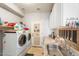 Functional laundry room with a sink, counter space, and modern appliances including a washer and dryer at 838 E Nolan Pl, Chandler, AZ 85249
