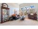 Bright living room featuring a piano, large windows, and comfortable seating at 838 E Nolan Pl, Chandler, AZ 85249