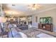 Open concept living area with modern furnishings, a large sectional sofa, and a view to the kitchen at 838 E Nolan Pl, Chandler, AZ 85249
