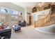 Bright living room with high ceilings, natural light, wood shutters, and a staircase to the second story at 838 E Nolan Pl, Chandler, AZ 85249