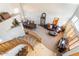Bright open-concept room with stairs and a view of a dining area with a long wooden table and chairs at 838 E Nolan Pl, Chandler, AZ 85249