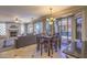 Open floor plan with a dining area adjacent to the living room and views of the backyard at 838 E Nolan Pl, Chandler, AZ 85249