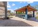 Outdoor bar area featuring seating and a custom tile roof, perfect for entertainment or relaxation at 838 E Nolan Pl, Chandler, AZ 85249