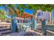 Outdoor kitchen with built in grill, bar seating, covered patio, and fire pit area at 838 E Nolan Pl, Chandler, AZ 85249